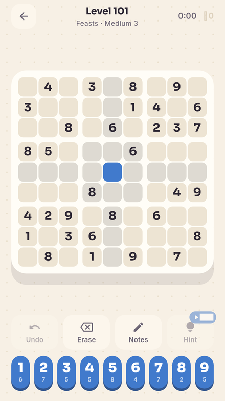 A 9×9 puzzle on warm paper with a candy digit pad